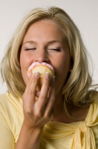 woman-eating-cupcake-199x300
